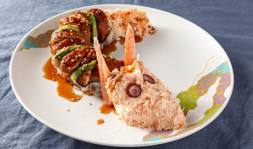 Dragon Roll · Snow crab, asparagus, and avocado. Topped with Bbq eel, avocado, snow crab, eel sauce, and sesame seeds.
