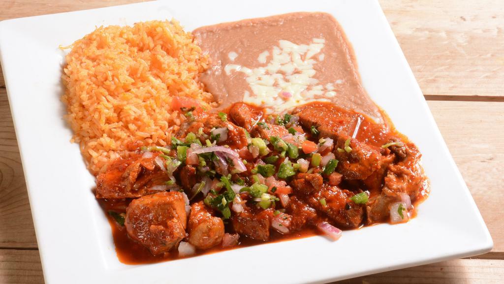 Carnitas A La Diabla · Grilled pork chunks topped with our homemade spicy sauce and pico de gallo. Served with mexican rice, refried beans and tortillas.