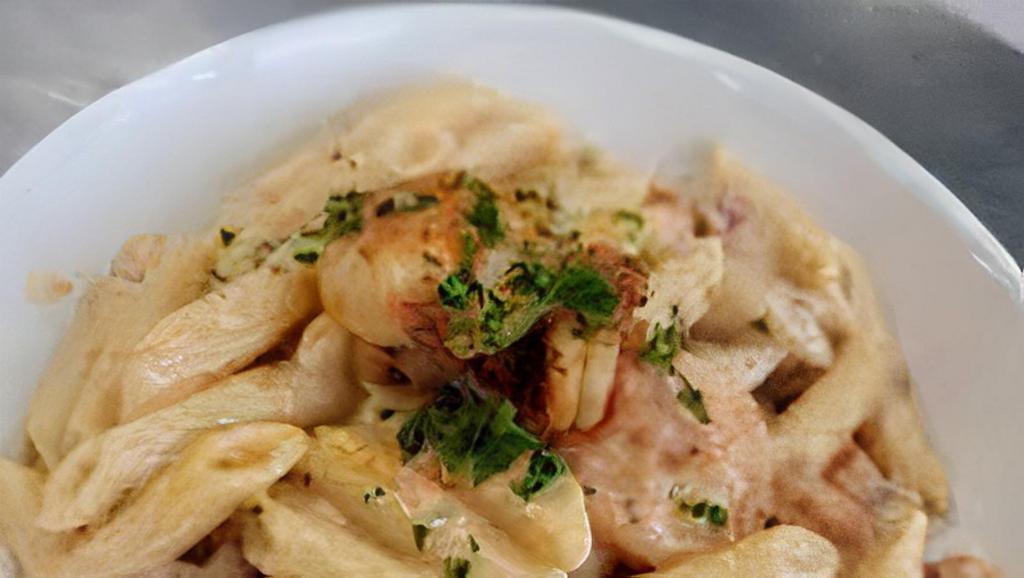 Shrimp Cajun Pasta · Alfredo sauce topped over penne noodles with cheese, red peppers and your choice of meat.