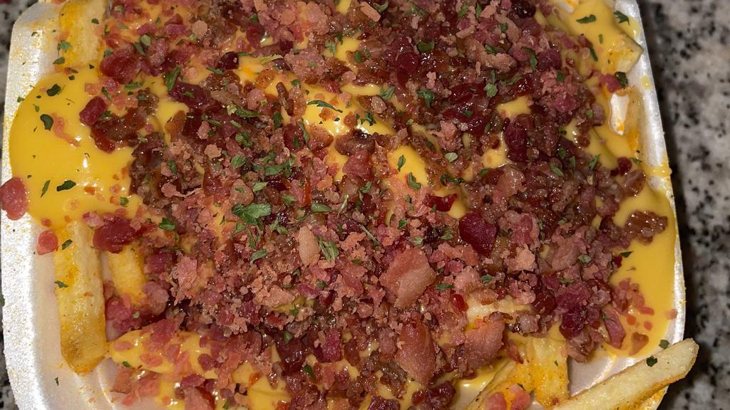 Bacon Cheddar Fries · Fries topped with seasoning, cheese, and bacon.