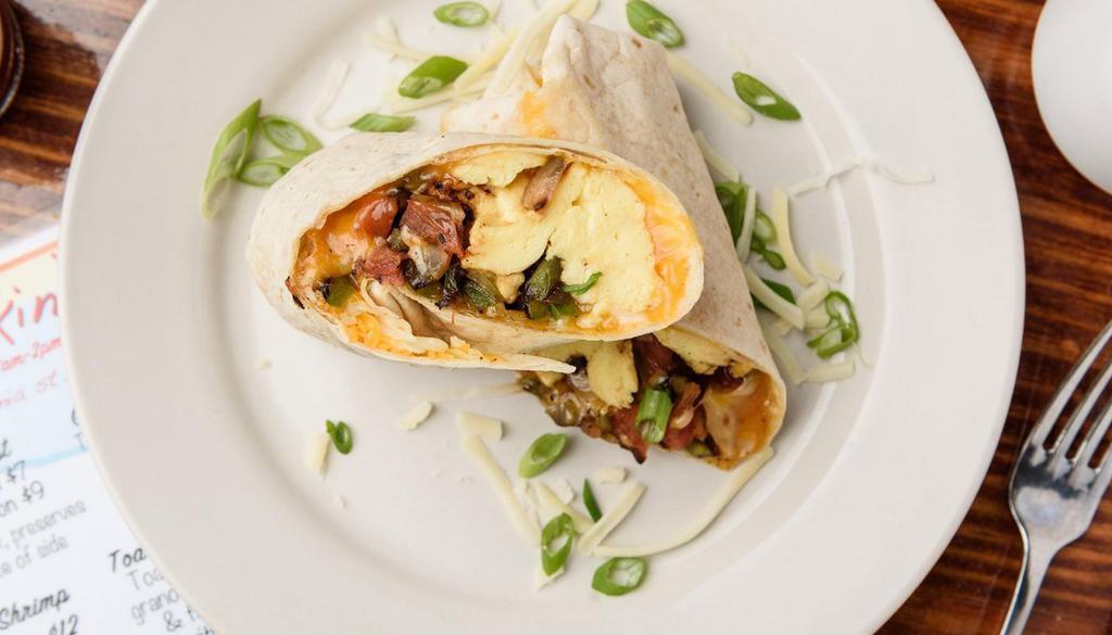 Confit'To Burrito. · In a flour tortilla, bacon confit, cajun smashed hash & avocado w/ scrambled eggs, cheddar & pepperjack cheeses served with sides of salsa & sour cream.