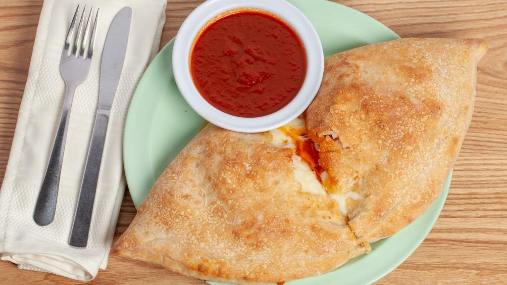 Stromboli (Small) · Inside: Pepperoni, Sausage, Beef, Mushrooms, Onions, Green Peppers, Tomato Sauce and Mozzarella Cheese.