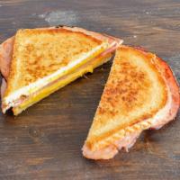 The Cheezy Pig · Grilled Bavarian ham and mouthwatering, melted cheese slices. Served on buttered, toasted wh...