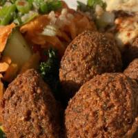 Falafel Combo · 5  falafels, 3 stuffed grape leaves, fresh hummus and mix salad, served with pita bread OR g...