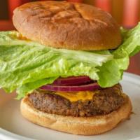Cheeseburger · Vegan. Daily baked burger patty, vegan Cheddar cheese, tomatoes, lettuce, red onions, pickle...