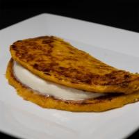 Cachapa Con Queso · Panqueca hecha con maiz dulce con queso. Sweet corn pancakes with cheese.