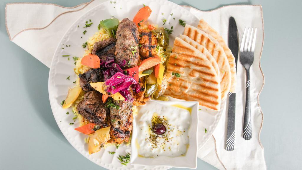 Greek Bistro Mixed Kabobs Platter · Beef filet mignon kabob, chicken kabob, kufta kabob, Greek Bistro rice, grilled vegetables, tzatziki, and pita bread.