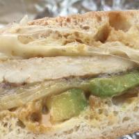 The Flash Panini · Poppy's seasoned grilled chicken, avocado, grilled onions, melted pepper jack and honey must...