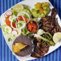 Churrasquito Chapin · Homemade marinated grilled steak. Served with grilled green onions, salad, beans. Guacamole ...