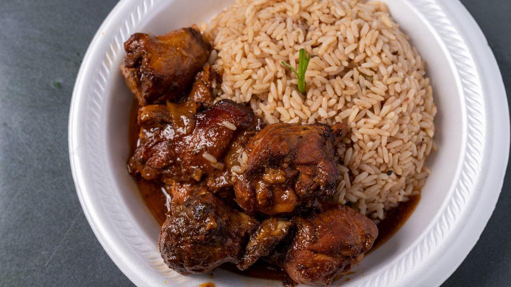 Brown Stew Chicken · Mild, Brown Stew Chicken served with Rice/Beans and your choice of one side