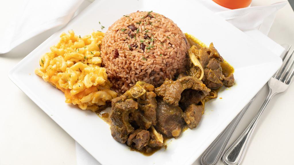 Curry Goat · Spicy Jamaican Curry Goat, served with Rice/Beans and your choice of one side