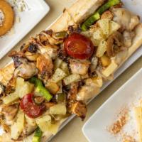 Jerk Salmon Phillie · Jerk Marinated Salmon with onions, sweet peppers, Pineapples, and pepper jack cheese on an A...