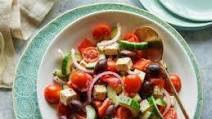 Greek Salad · Mixed greens with red onions, tomatoes, cucumbers, black olives, and feta cheese