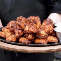 Smoked Wings 25 Count · Pecan wood smoked wings tossed in house rub, served with choice of ranch or blue cheese dres...