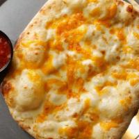 Cheesy Breadsticks · Hand-Stretched Dough, Shredded Mozzarella and Cheddar Cheese with Side of Marinara Sauce