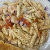 Cajun Shrimp · Grilled Shrimp Served Over Penne Noodles with Cajun Seasoning & Our Special Alfredo Sauce.