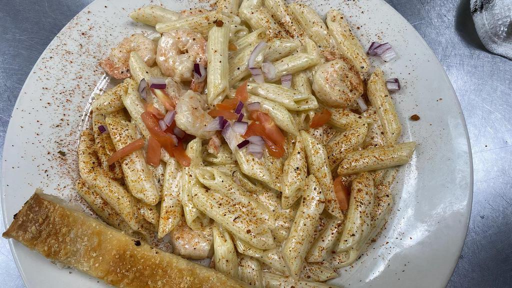 Cajun Shrimp · Grilled Shrimp Served Over Penne Noodles with Cajun Seasoning & Our Special Alfredo Sauce.