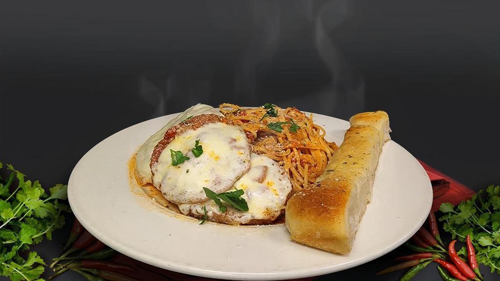 Eggplant Parmesan · Egg Plant Served Over Spaghetti with Provolone Cheese & Our Special Homemade Marinara Sauce.
