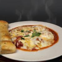 Beef Ravioli · Small stuffed shells filled with Ground Beef & topped with a Cheese Blend & Our Special Home...