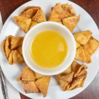 Crab Rangoon (6) · Deep-fried wontons stuffed with a blend of cream cheese and crab meat