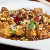 Sesame Chicken* · Spicy hot. Lightly battered fried chicken with sesame seeds in a hot spicy sauce.