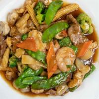 Triple Crown · Jumbo shrimp, chicken and beef stir-fried with broccoli, snow peas, water chestnuts, bamboo ...