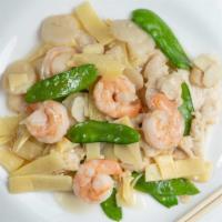 Phoenix Dragon · Sliced tender chicken breast stir-fried with shrimp, bamboo, water chestnuts and snow peas i...