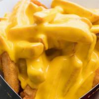 Cheesy French Fries · Hand cut potatoes drizzled in creamy cheese.
