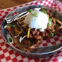 Frito Pie · Cut open a bag of Fritos, dump in some homemade chili, mixed cheese, top with sour cream and...