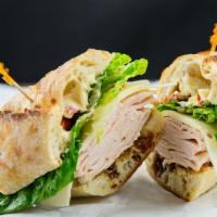 Turkey & Provolone · Boar’s head oven gold turkey & provolone with green leaf lettuce, roasted red tomatoes, fini...