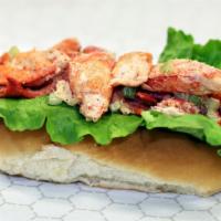 Lobster Roll · Maine lobster with a touch of mayo and celery served in a classic New England split top roll...