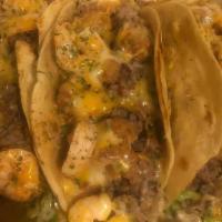 Chicken, Steak Or Shrimp Tacos · Three pieces. Comes with lettuce, tomatoes, and cheese. Sour cream and taco sauce are provid...