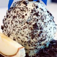 Cookies & Cream Apple · Caramel apple, rolled in crushed chocolate cookies, coated with white chocolate, then topped...