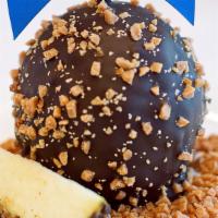 Chocolate Toffee Krunch Apple · Caramel apple, rolled in scrumptious toffee pieces, coated with Belgian milk chocolate or Be...