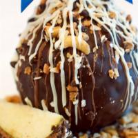 Grand Finale Apple · Caramel apple, rolled in toffee pieces, coconut, chocolate chips and cashews, coated with Be...