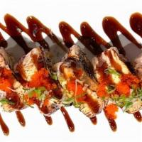Salmon Delux Roll · Spicy Salmon, Cucumber, Tempura, Crunch. Top Salmon, Toast, Masago, Green Onion and Eel Sauce