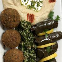 Stella Maris Special · Hummus, baba ganuj, grape Leaves, Tabouleh, falafel, and eggplant salad.