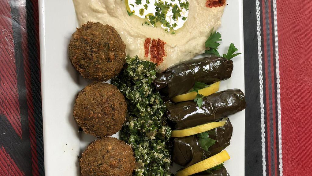Stella Maris Special · Hummus, baba ganuj, grape Leaves, Tabouleh, falafel, and eggplant salad.