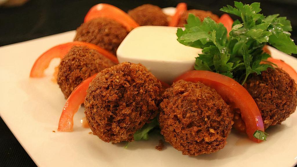 Falafel (6 Balls) · Ground chickpeas with onions, parsley, and garlic, then blended with special seasonings and fried to perfection.