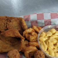 Shrimp & Flounder Basket · 6 jumbo shrimp and 2 filets of fried flounder served with two hushpuppies and two sides of y...
