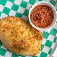 Pepperoni Calzone · Our peperoni calzones are prepared with ricotta cheese, and mozzarella cheese, and served wi...