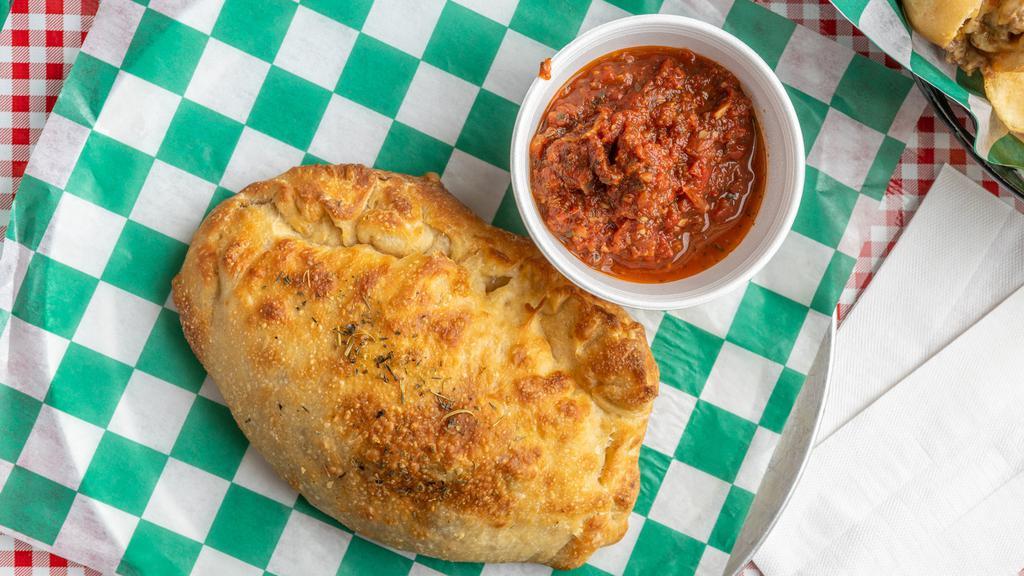 Pepperoni Calzone · Our peperoni calzones are prepared with ricotta cheese, and mozzarella cheese, and served with a side of our house marinara.