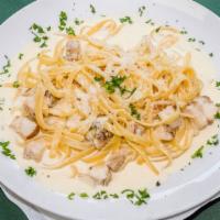 Chicken Alfredo · Grilled chicken over fettuccine noodle topped with alfredo sauce