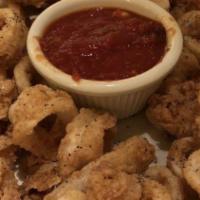 Calamari Fritti · Breaded calamari rings fried to a golden brown and served with sauce