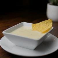 Cheese Dip · Homemade Cheese Dip, comes with Mexican corn tortilla chips and a large container, so you wi...