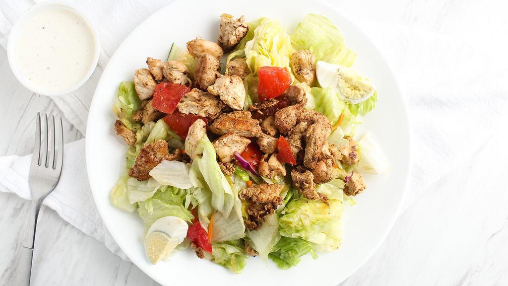 Grilled Chicken Salad · With lettuce, tomato, cucumber, marinated grilled chicken and cheese.