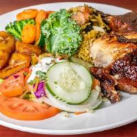Jerk Chicken Platter · Served with Rice, Mixed Vegetables, Dinner Roll.