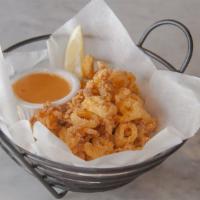 Fried Calamari · Marinated and lightly battered, then gently fried, served with Treme sauce