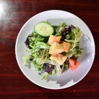 House Salad · Cucumber, tomato, croutons, a balsamic reduction and served with Dijon vinaigrette and fresh...