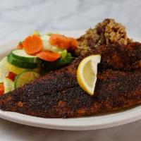 Blackened Redfish · Fresh catch of the day served with seasonal steamed vegetables and chicken and andouille sau...